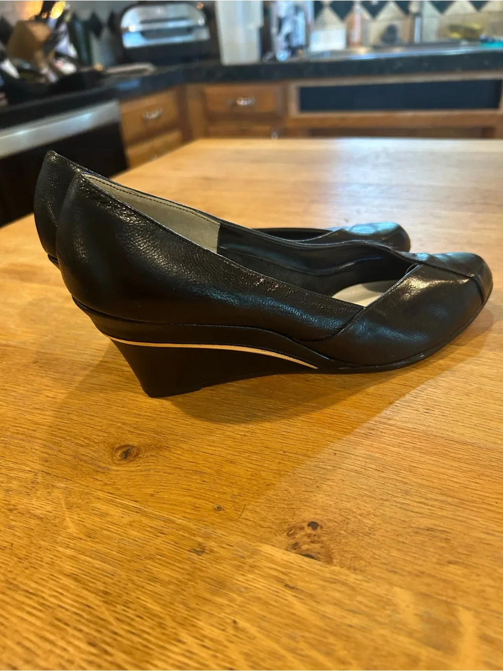 Black Leather Pointed-Toe Wedge Pumps